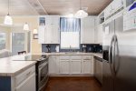 Well stocked, updated kitchen has dishwasher, microwave, coffee maker and more